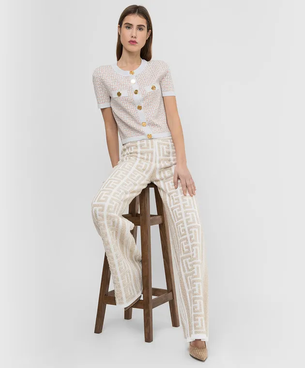 Balmain Pantaloni a zampa con motivo monogramma XF1PQ035KB32