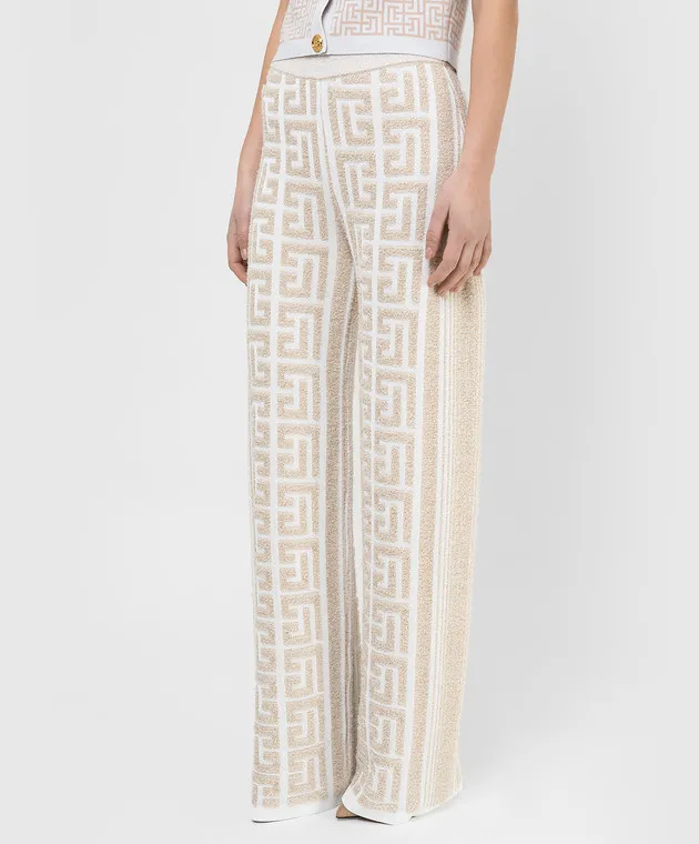 Balmain Pantaloni a zampa con motivo monogramma XF1PQ035KB32
