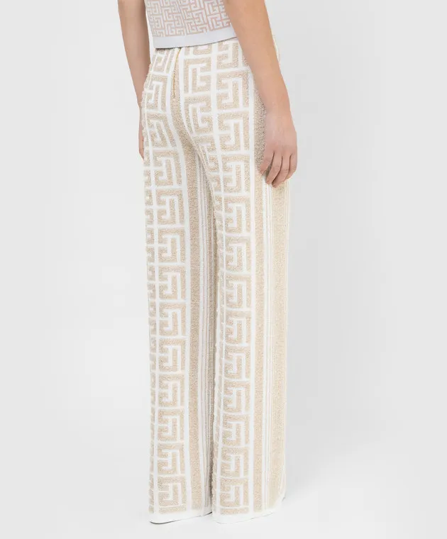 Balmain Pantaloni a zampa con motivo monogramma XF1PQ035KB32