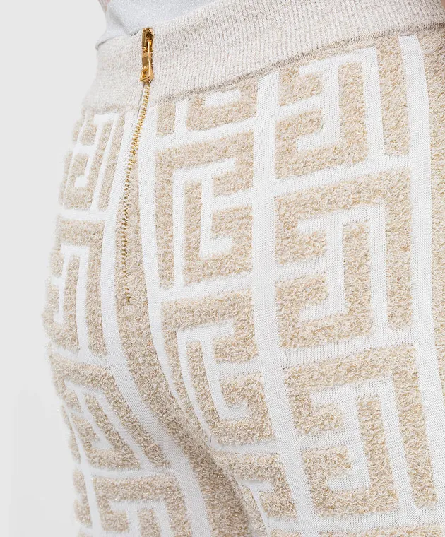 Balmain Pantaloni a zampa con motivo monogramma XF1PQ035KB32