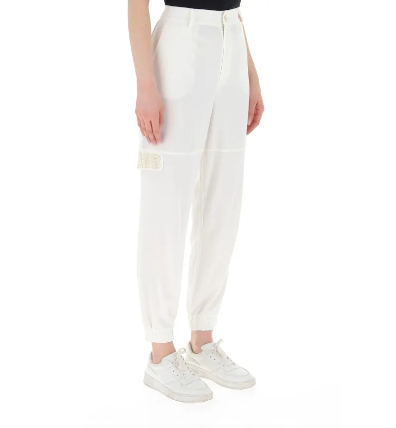 Pantalone con borchie